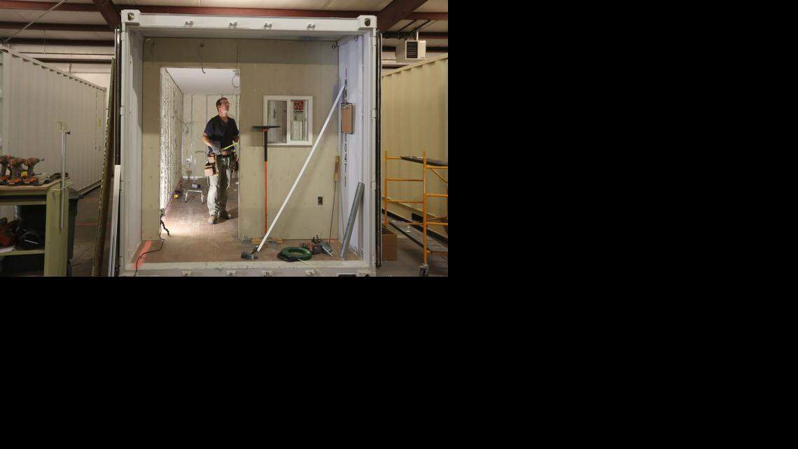 
Kyle Stevens works on a shipping container that will become a medical office at Clinic in a Can. The organization’s goal is to send eight or more to Liberia to help with the Ebola disaster response. (Oct. 20, 2014)
