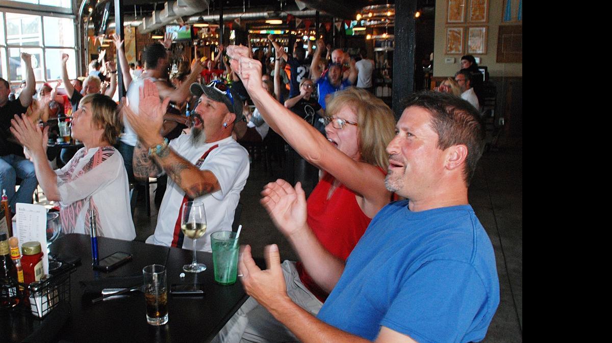 
From left, Misty Bell, Billy Veges, Katheryn Lyon and Bret Lyon cheer for the U.S. women Sunday evening at The Monarch during a World Cup finals watch party.
