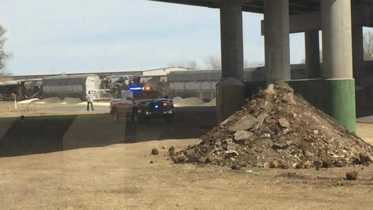 Authorities investigate a train derailment in Augusta on Friday afternoon.