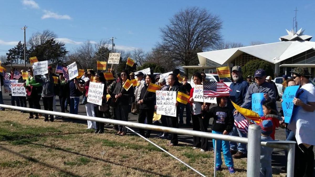 Local residents gather at All Saints Catholic Church on Saturday to show support for protests planned Sunday in Vietnam.