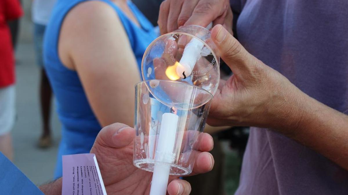 
Candles were used to remember the victims of recent gun violence in Wichita. About 50 people attended a vigil Sunday at 21st and Hillside, near where a Wichita State University student was shot to death in a dormitory parking lot.
