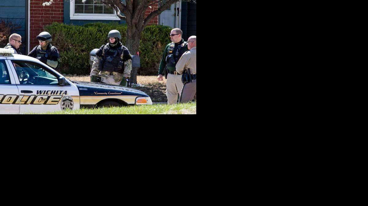 
Members of the Wichita police bomb squad respond after a live grenade was discovered Thursday at 5081 E. Willow Point in Bel Aire. (March 26, 2015)
