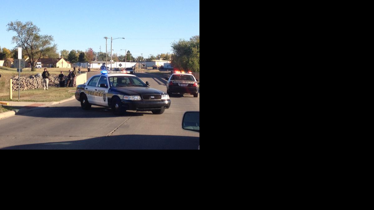 
Police at the scene where a man’s body was found Friday were telling residents and children walking home from nearby Colvin Elementary School to find other routes past the bridge. 
