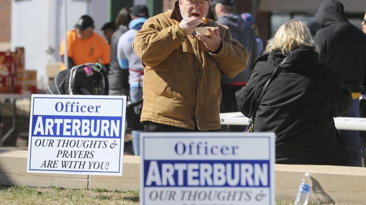 Rick Farrier enjoys a bowl of chili during a fundraiser in Old Town Square on Saturday. The Wichita Wagonmasters organized a chili feed to raise money for Wichita police Officer Brian Arterburn, who was seriously injured in the line of duty a couple of weeks ago.