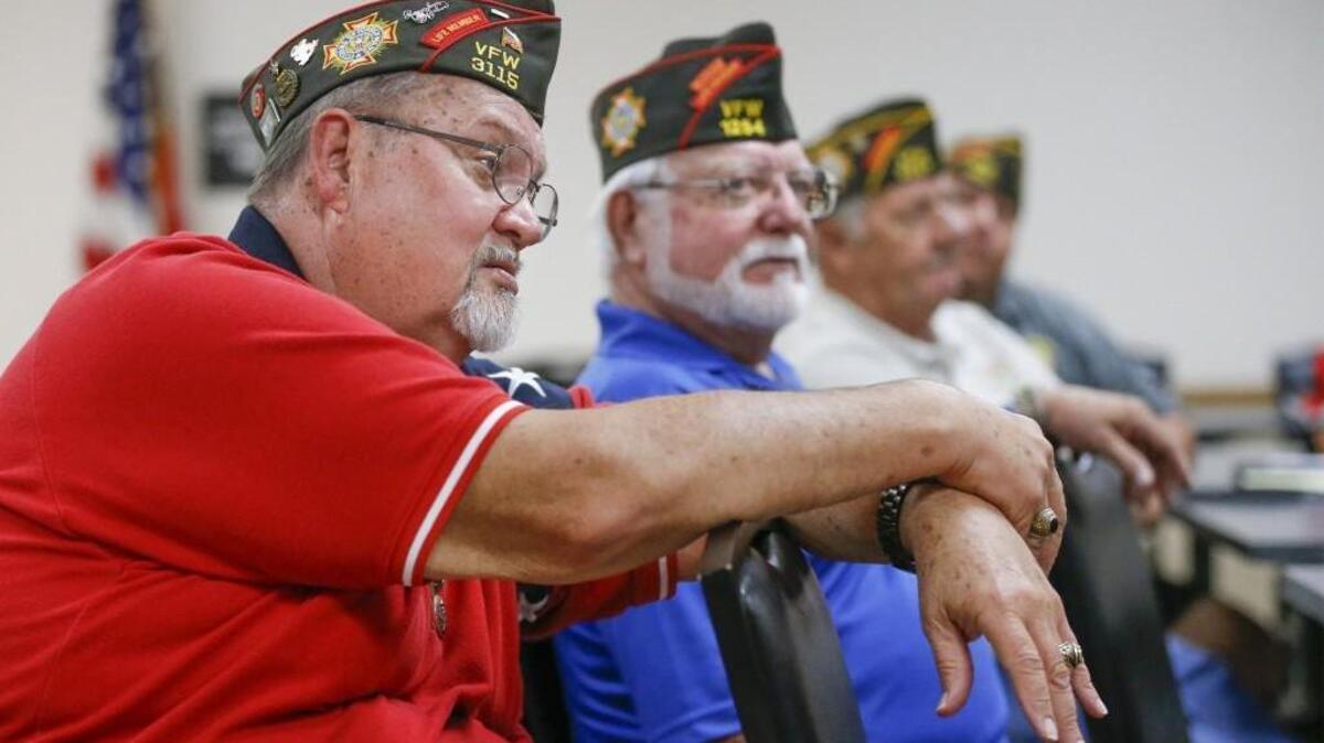 Vietnam veteran James Denison, left, talks about the future of VFW chapters during a meeting at Post 6957 in Haysville.