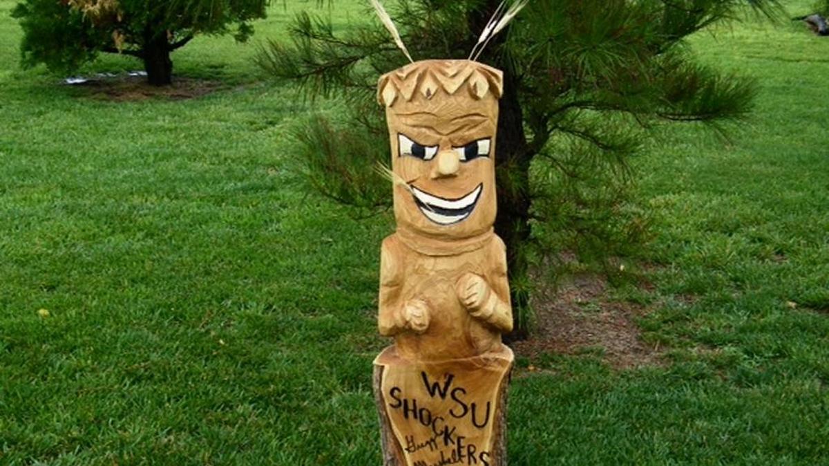 The 4-foot WuShock wood statue was carved with a chainsaw by Ken Lockwood and will be auctioned off. Proceeds will go to help with Julie Dombo’s medical expenses.