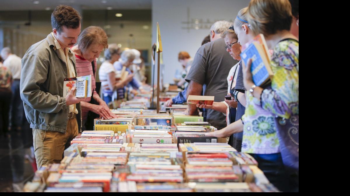 
Shoppers browse through book titles Saturday at the Art and Book Fair at the Wichita Art Museum. The event continues Sunday.
