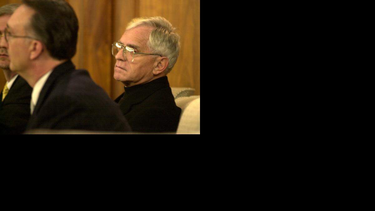 
Former area priest Robert Larson, right, listens as his attorney Dan Monnat enters a plea of not guilty on several charges of sexual abuse. Larson was charged in Harvey County District Court in 2000.
