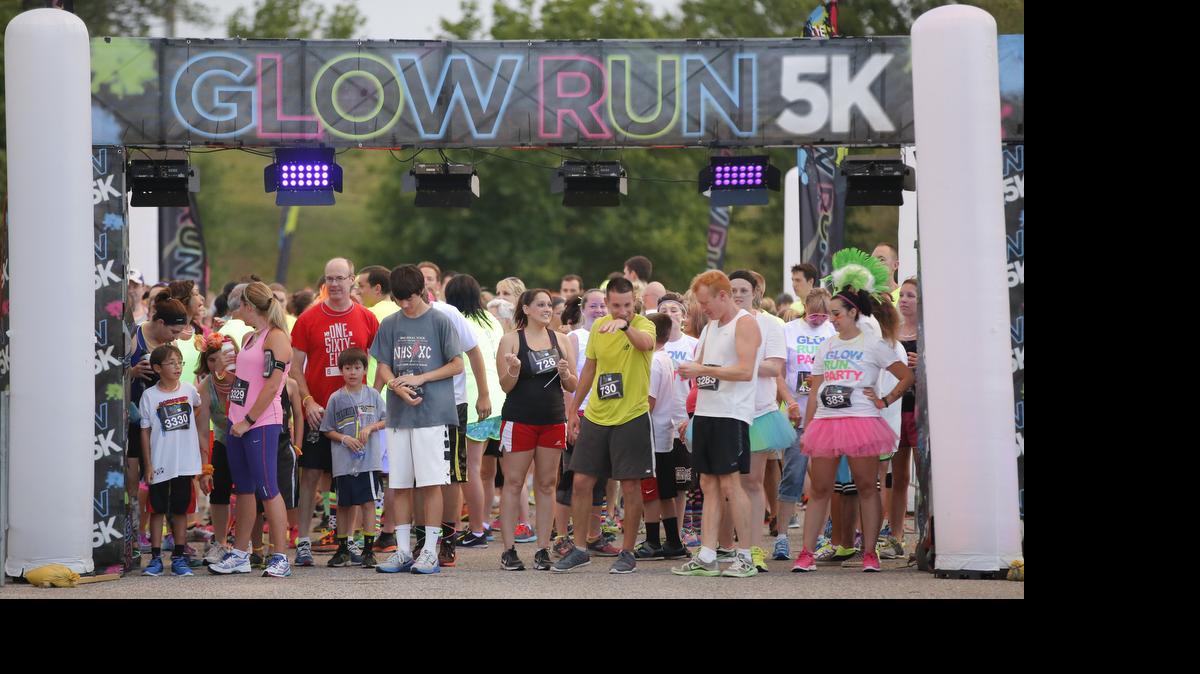 
Participants in the Glow Run 5K race line up at the starting line at the Wichita Ice Center on July 11. Several races from out of town, like the Glow Run, have come into Wichita in the last few years, creating an over-saturation of races, some organizers say.
