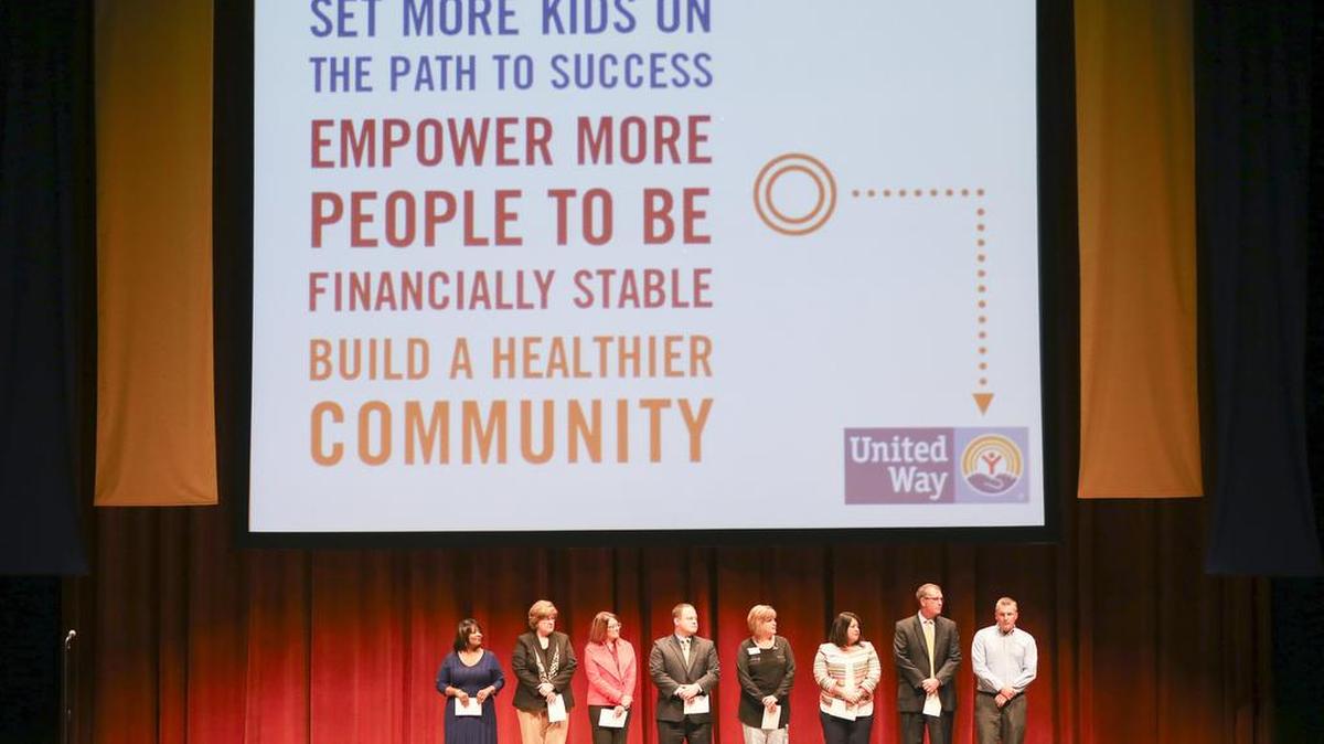 Community and business leaders stand on stage during the United Way’s fundraising kickoff event in September at Century II.