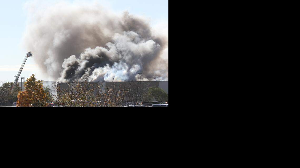 
Firefighters fight a fire at the Flight Safety and Cessna Citation training center building at Mid-Continent Airport in Wichita, Kansas, Thursday October 30, 2014 shortly after a Beechcraft King Air crashed into the building killing several people including the pilot. (Oct. 30, 2014) 
