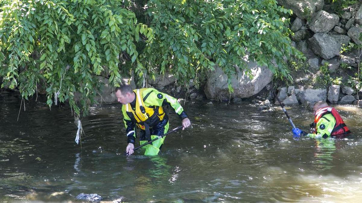 Wichita firefighters scour the banks of Gypsum Creek on Monday, continuing the search for an 11-year-old boy who was swept away in high, fast-moving waters on May 27 in south Wichita. (May 30, 2016)