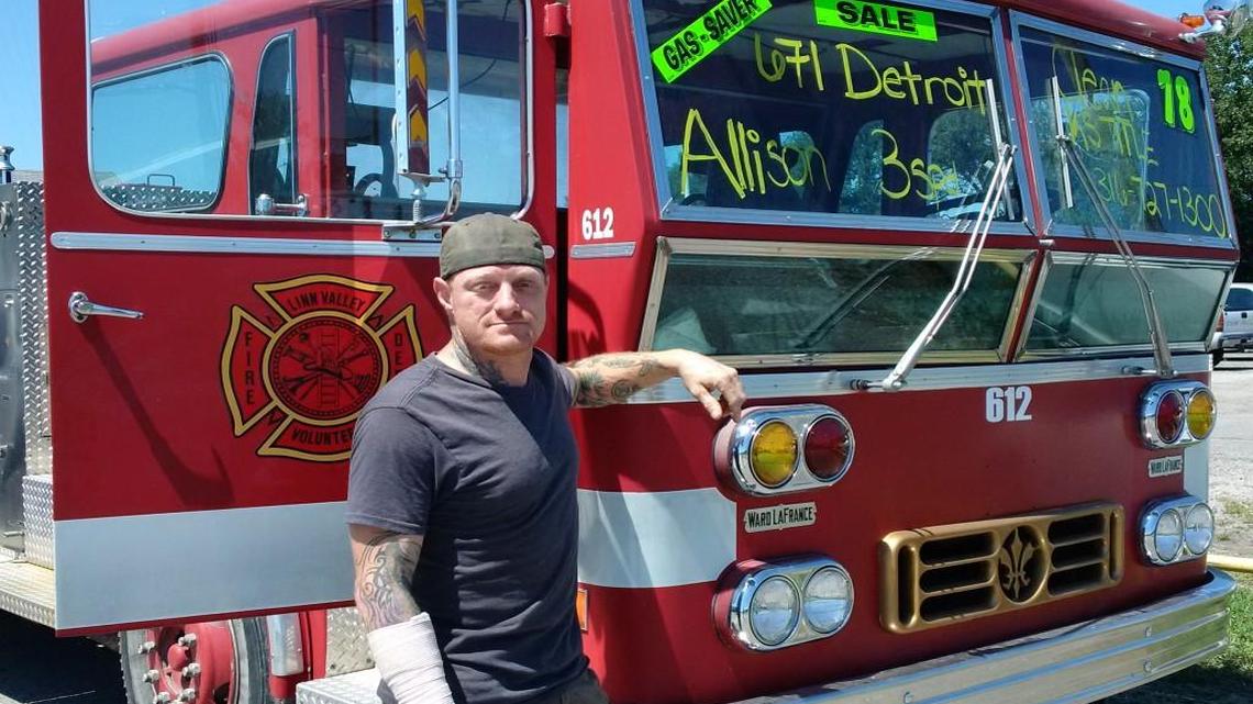 James Porter of CAG Auto with the fire engine he has for sale on his used car lot.