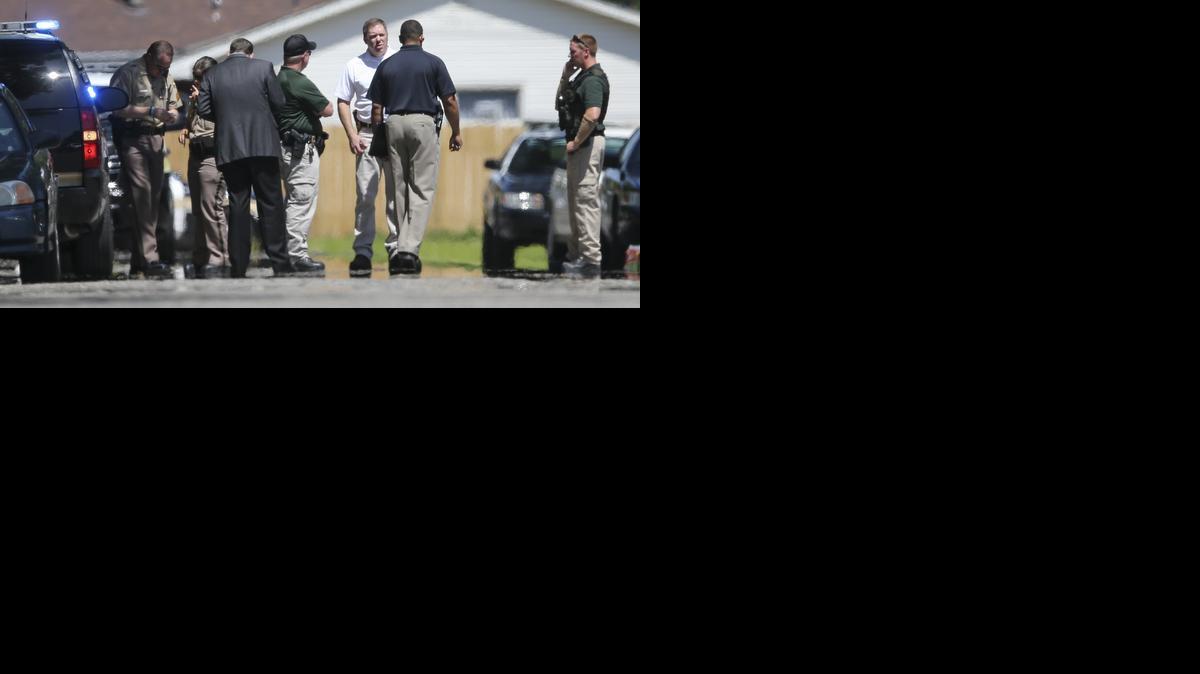
Police investigate the scene where a police shooting took place July 4 near Lincoln and Rock. Icarus Randolph was killed. (July 4, 2014)
