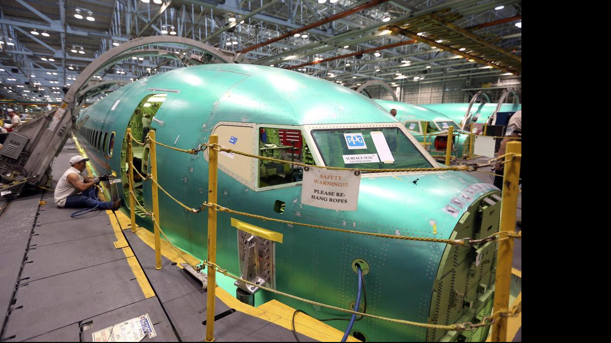 
Spirit AeroSystems employees work on a Boeing 737 in June 2014. Spirit on Thursday downplayed any hard feelings from an exchange on Wednesday in which Sedgwick County Commissioner Richard Ranzau called a Spirit executive’s comments “insulting.” 
