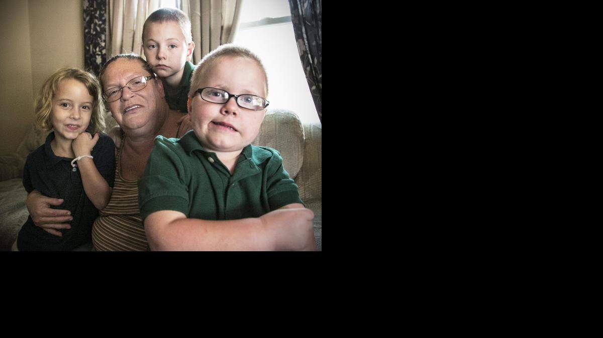 
Julie Feagan is unemployed and the full-time caregiver for her grandchildren Alyea, left, Chase and Ryan Skinner. 
