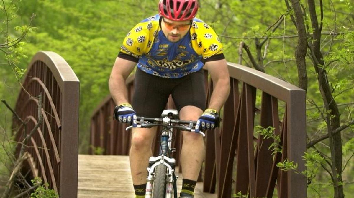 A member of the Oz Bicycle Club rides the trails at Pawnee Prairie Park. Declining membership and the increased use of social media to set up bike rides has led the club to disband after more than 40 years.