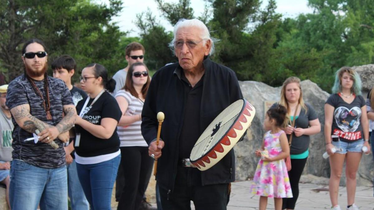 Truman Ware, Mekko Stumblingbear’s uncle, sings an American Indian song at a vigil memorializing Stumblingbear. (April 23, 2016)