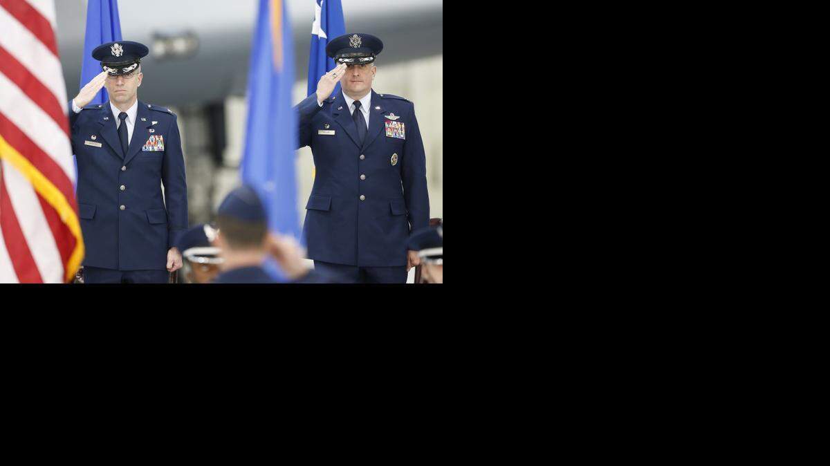 
Outgoing commander of the 22nd Air Refueling Wing, Col. Joel Jackson (left) and incoming commander Col. Albert Miller salute during the playing of the National Anthem Thursday afternoon during the change of command ceremony at McConnell Air Force Base.
