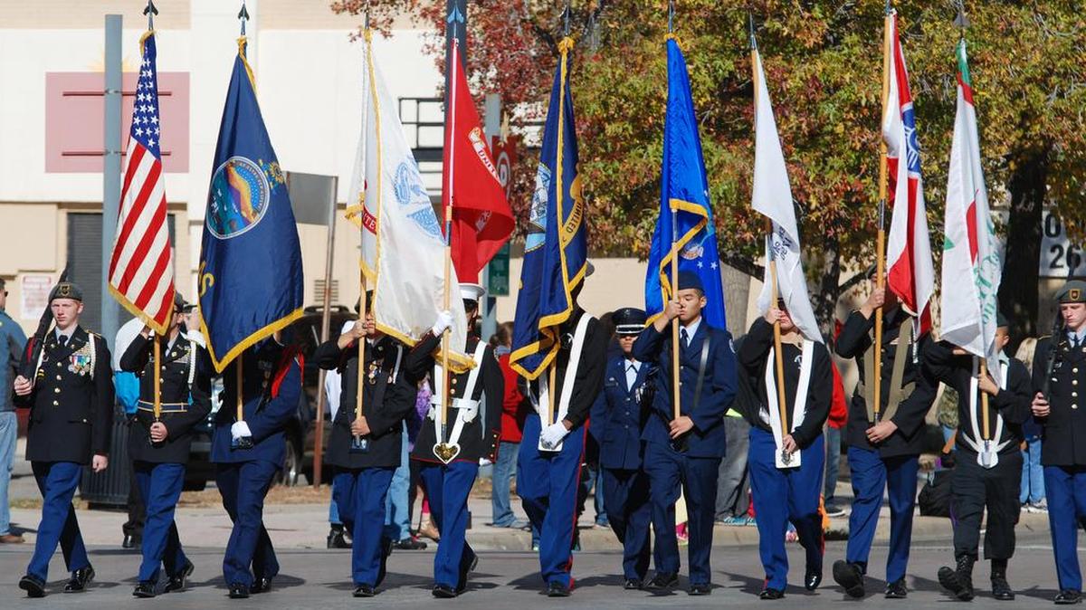 The JROTC color guard marches in the Veterans Day Parade in downtown Wichita in 2014.