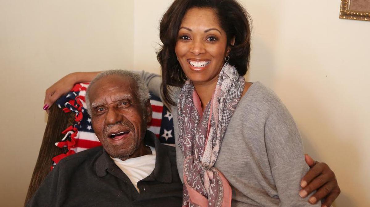 John Monk with his granddaughter Kay Monk-Morgan. “He came out of Louisiana as a kid with nothing,” she says. “Now look what he’s done.” Monk will turn 100 on Jan. 9, 1916. (December 29, 2015)