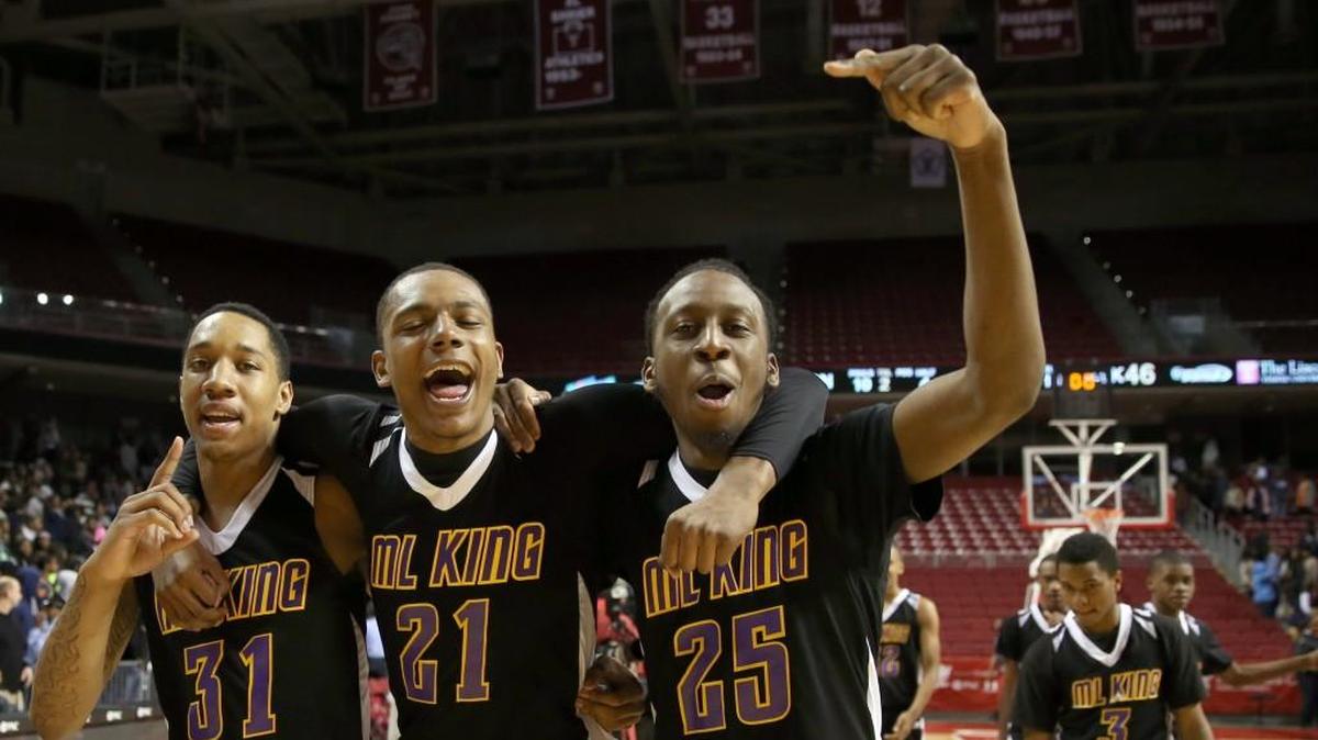 Rasool Samir, front right, celebrates with teammates in his hometown of Philadelphia after helping lead his team to a high school championship in 2014.