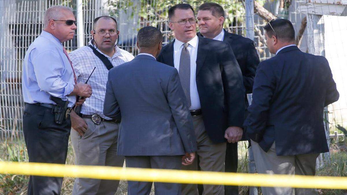 
Wichita Police detectives work outside of a home on South Ida where a couple was found dead in their home in October 2014.
