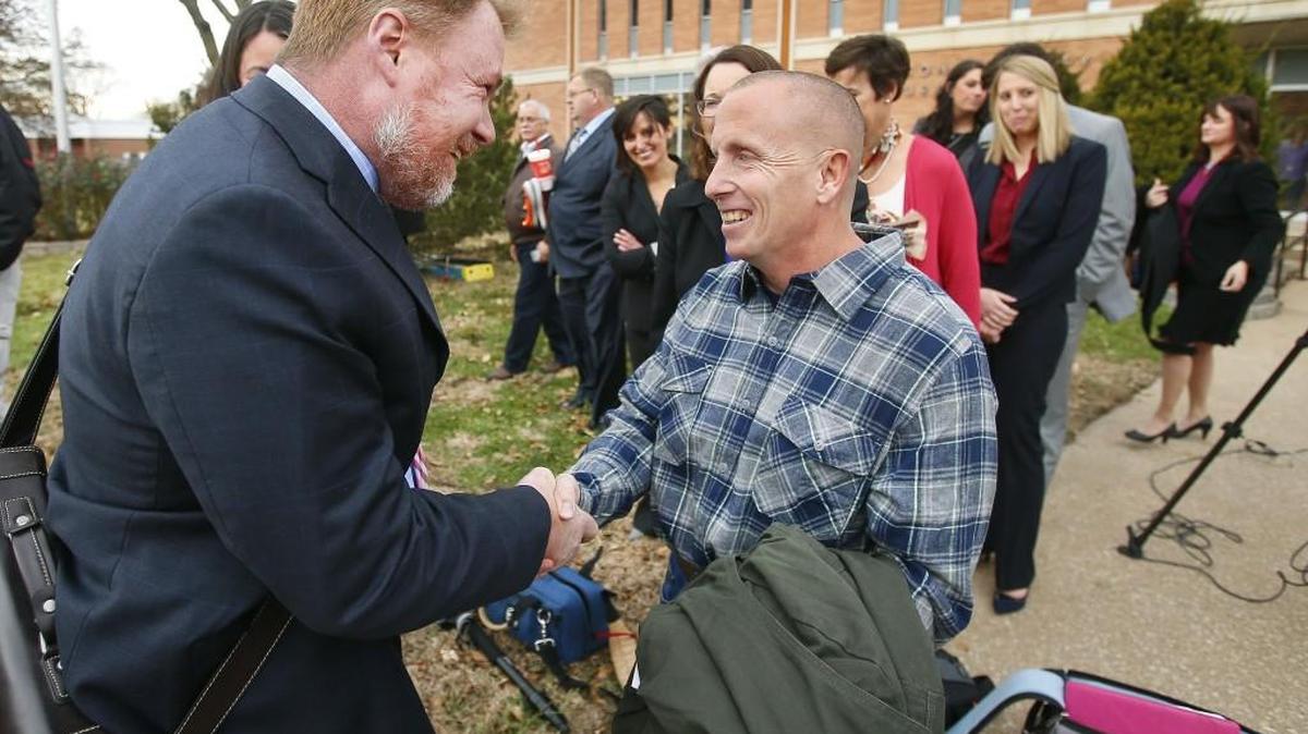 Floyd Bledsoe, right, is greeted by Oliver Burnette, executive director of the Midwest Innocence Project, after being released from prison in December.
