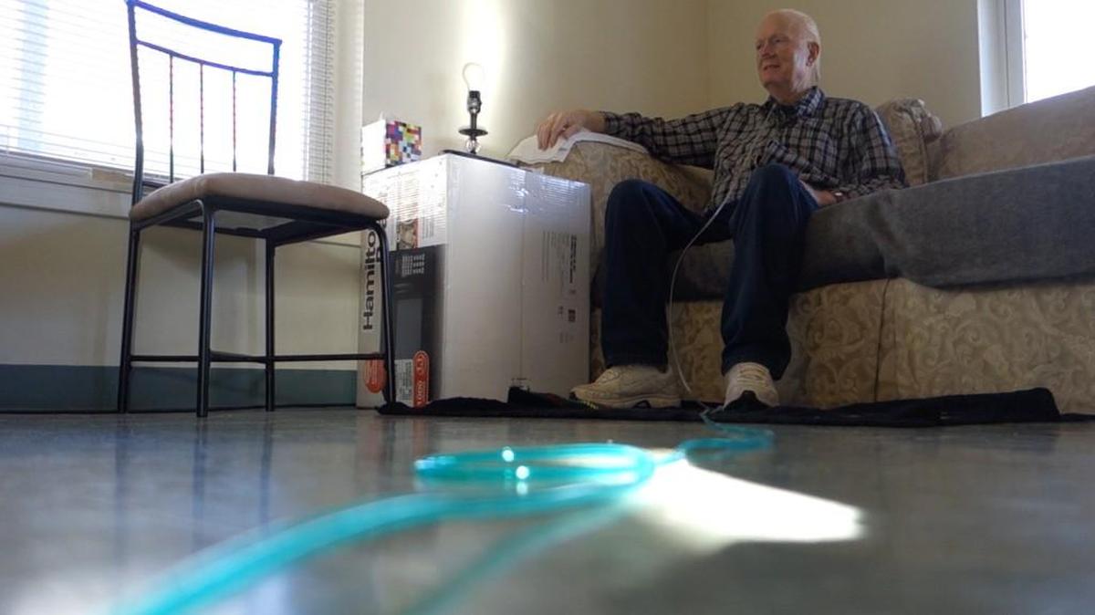 Although Richard Reser has been free for six weeks, because of heart problems that make his breathing difficult, he still spends most of his day in his apartment watching TV.