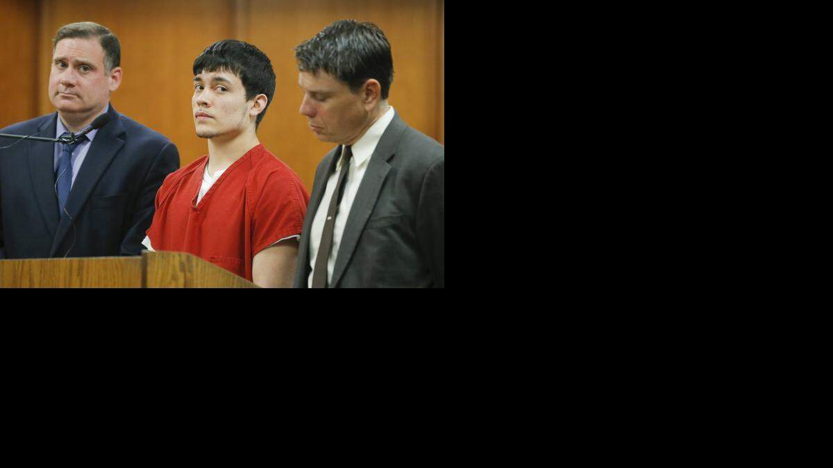 
Anthony Bluml stands between his attorneys, Mark Manna, left, and Gary Owens, right, during Bluml's arraignment on murder charges Wednesday. Bluml is one of four people accused of being part of a murder plot to kill his adoptive parents. Bluml will stand trial on two counts of first-degree murder this November.
