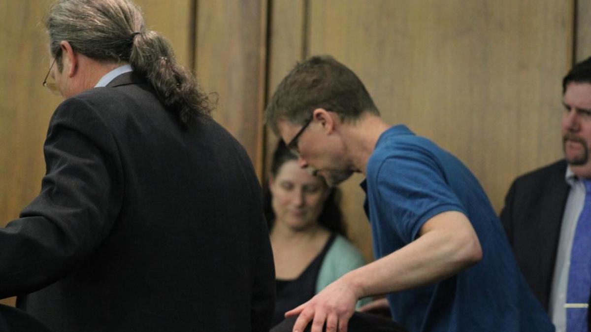 Jim Nachtigal enters Harvey County District Court for a hearing Friday afternoon. Nachtigal and his wife, Paige, are facing 12 felony charges related to child abuse.