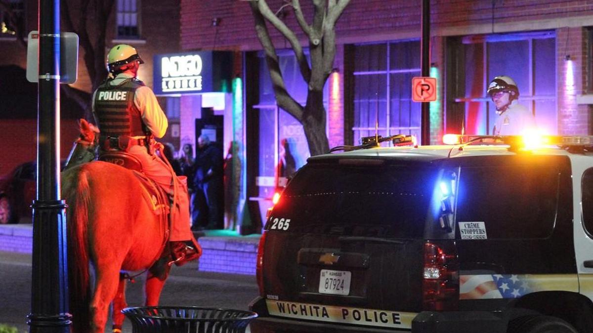 Wichita police respond to a disturbance outside the Indigo Lounge in Old Town shortly before closing time Sunday morning. (March 6, 2016)