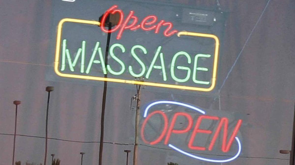 Captured in 2016, a sign hangs in the window of a massage parlor in west Wichita that was under investigation on suspicion of prostitution in 2010. Police have identified several ilicit parlors in Kansas, including in Johnson County.