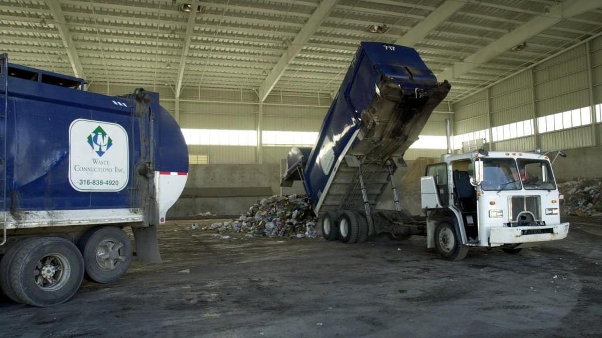 Trash is unloaded at the Waste Connections transfer station.