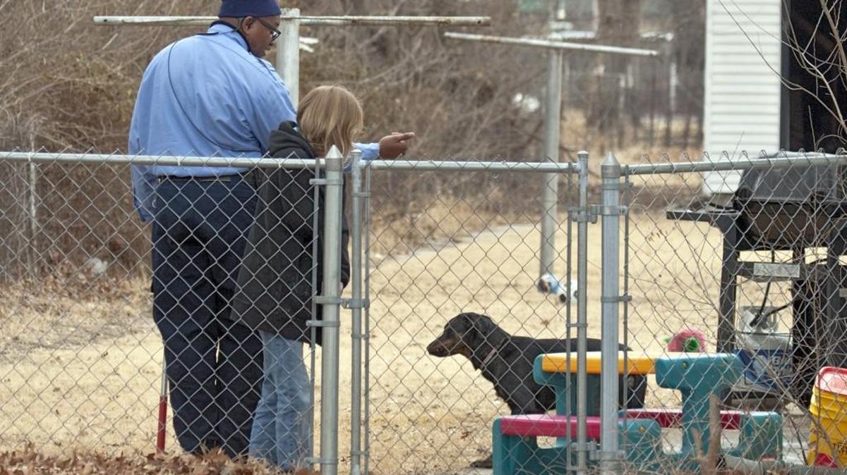 Wichita Animal Control Officer Ron Walton talks with a dog owner in 2011. (File photo)