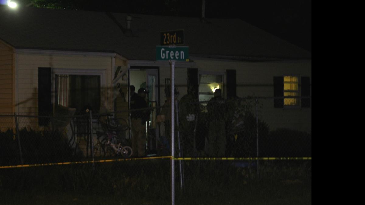 
Wichita police officers look through a house in the 2400 block of North Green where a woman’s body was found around 6:30 p.m. Thursday. Police are investigating it as a suspicious death.
