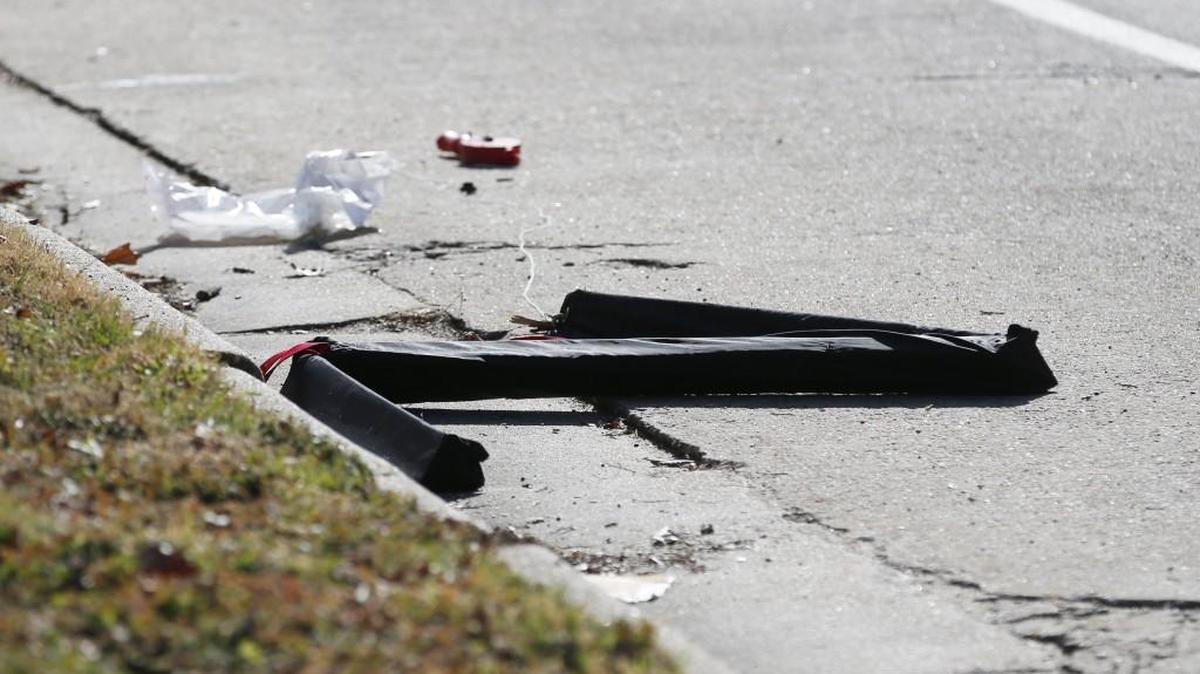 A police spike strip lies in the street at Kinkaid and Topeka. Police and sheriff officers investigate the scene at Kinkaid and Topeka after an officer was struck by a car driven by a felony suspect. (Feb. 7, 2017)