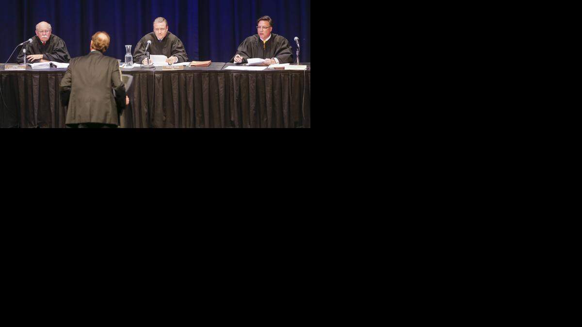 
From left, Judges Joseph Pierron, David Bruns and Anthony Powell of the state Court of Appeals hear arguments in the case of Donald L. Davis on Tuesday on the campus of Wichita State University. Davis, who is represented Randall Hodgkinson (back to camera), was convicted in 2012 of rape and human trafficking under Kansas’ version of Jessica’s Law.
