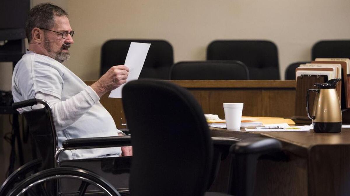 
With his standby counsel in the gallery, F. Glenn Miller Jr. read through a list of witnesses handed to him by the prosecution on Aug. 5. 
