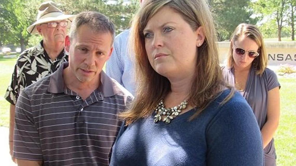 Amy Scott James and other friends and family of the Carr brothers’ victims gather outside the Kansas Supreme Court in August in support of a campaign to oust four of the court’s justices from office.