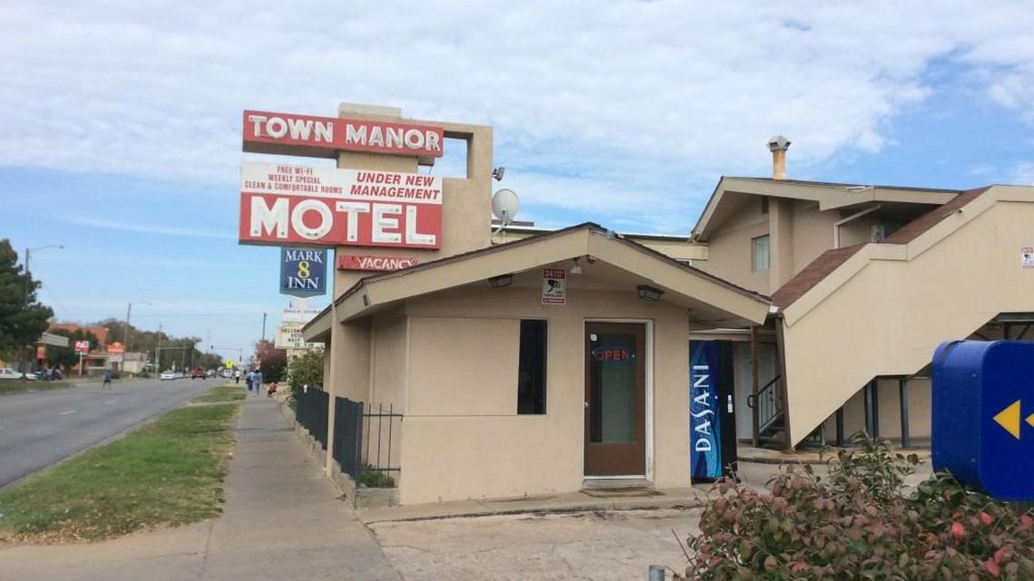 Two men were shot while sitting in a truck in the parking lot of the Town Manor Motel early Saturday morning, police say.