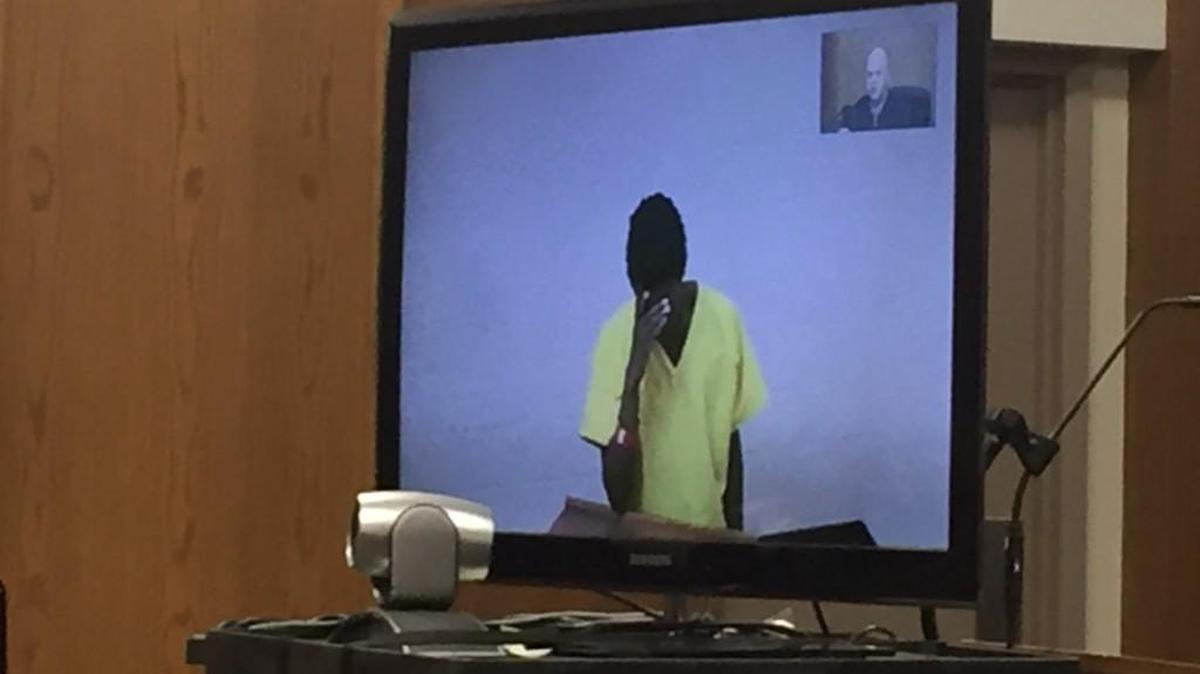 Michael Ross, 21, reacts to hearing first-degree murder charges against him in the death of a 17-month-old child over the weekend.