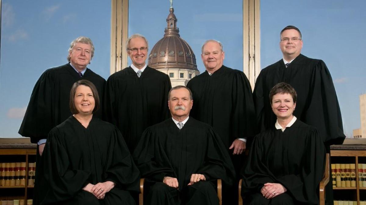 Kansas Supreme Court justices. Seated, from left: Marla Luckert, Lawton Nuss and Carol Beier. Standing, from left: Dan Biles, Eric Rosen, Lee Johnson and Caleb Stegall.