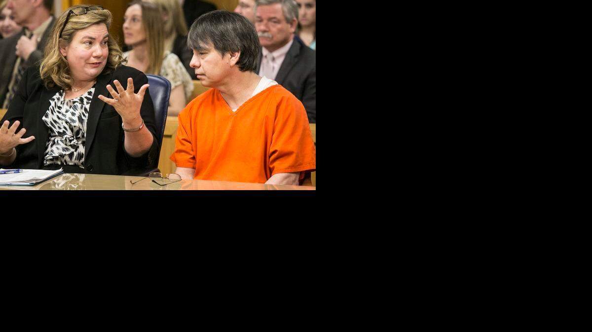 Defense attorney Alice Osburn speaks with Daniel Perez before his sentencing on 28 convictions including murder, rape and sexual exploitation of a child in Sedgwick District Court in Wichita on Tuesday.