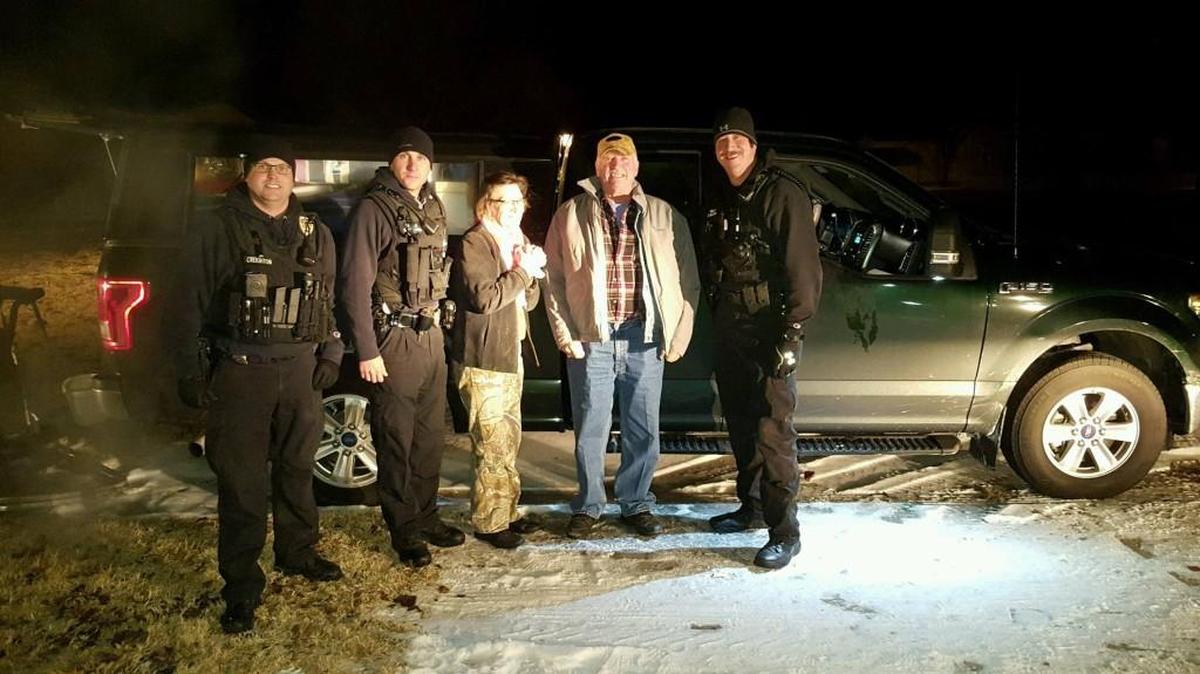 Officers Seth Creighton, left, Seth Doshier, second from left, and Kevin McKenna, right, helped Bonnie Goldman and Gary Miller after their truck and their dog were stolen.
