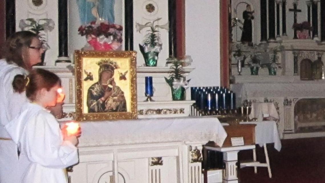 This icon of Our Lady of Perpetual Help, shown on the altar at St. Joseph church, was recently stolen.