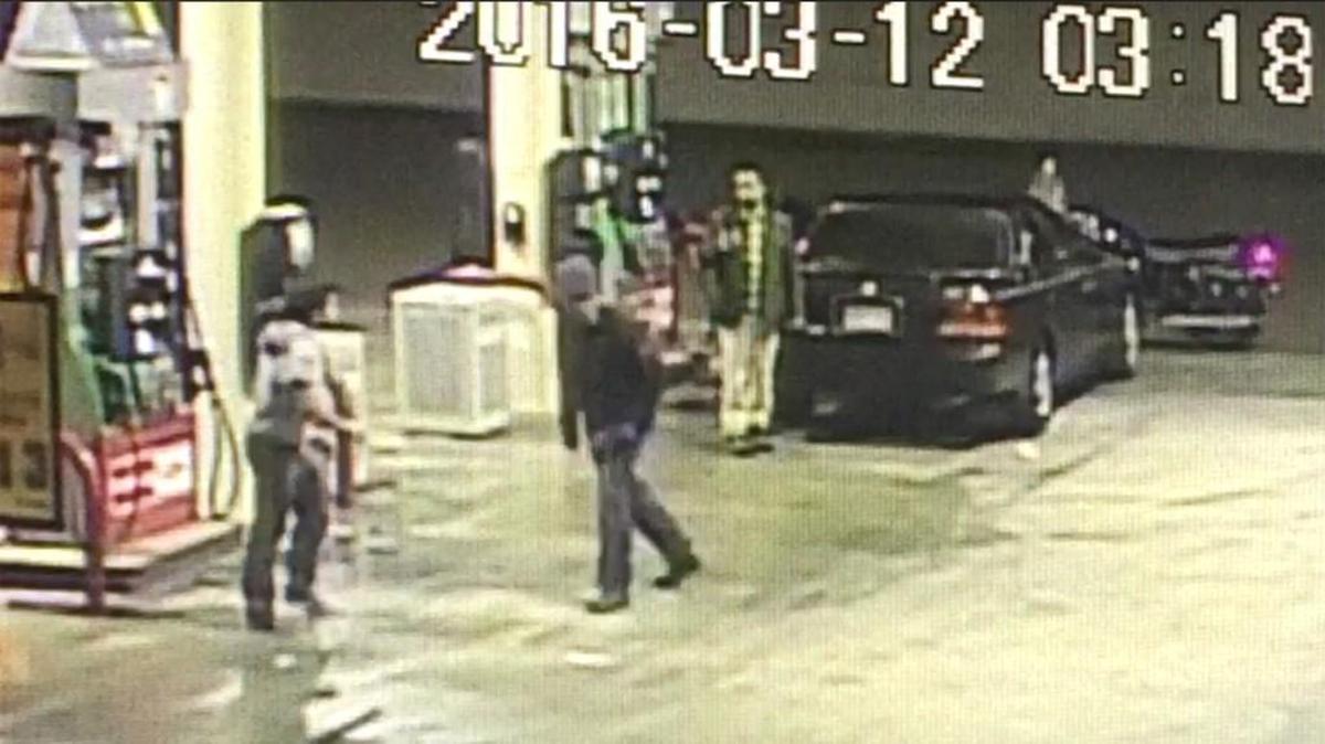 This screenshot of video provided by Wichita police shows an altercation between a man on a motorcycle and two Wichita State University students outside a convenience store in March.