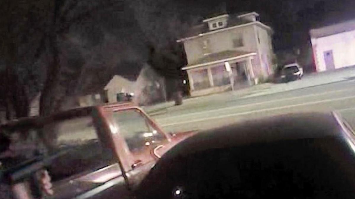 A frame from body camera footage from a Wichita police officer. At left is the gun that was used to fatally shoot Andrew Finch at 1033 W. McCormick.