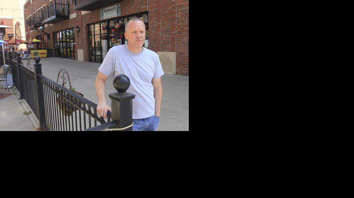 
Jason Van Sickle, president of the Old Town Association, stands near some shops in Old Town Square. Van Sickle is making store owners aware of a rash of burglaries in the area and hopes to increase measures to prevent any future break-ins. (Sept. 19, 2014) 
