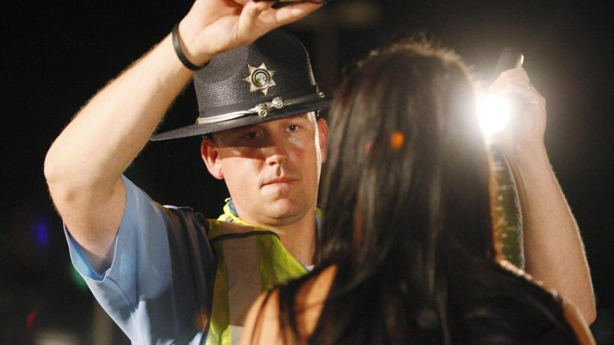 A Sedgwick County sheriff’s deputy performs a sobriety test on someone who was stopped at a DUI checkpoint.